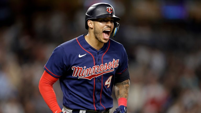 Minnesota Twins' Carlos Correa reacts after hitting a two-run home run against the New York Yankees during the eighth inning of a baseball game Thursday, Sept. 8, 2022, in New York. (Adam Hunger/AP Photo)