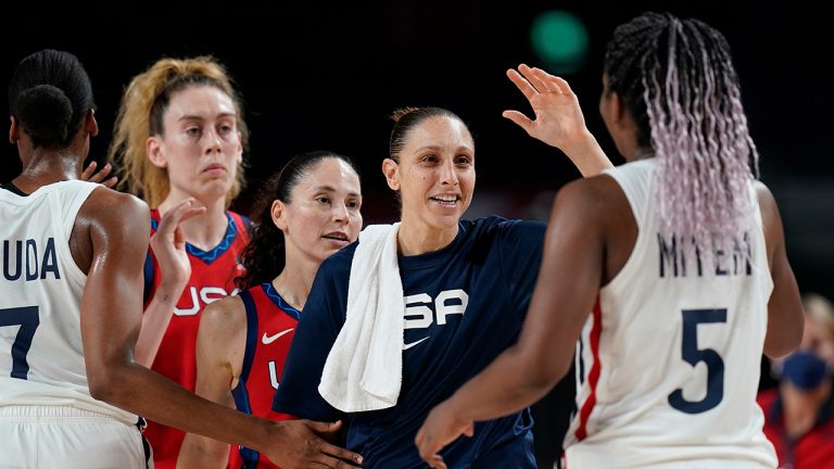 United States' Diana Taurasi, second right, followed by Sue Bird  and Breanna Stewart  greet France's Endene Miyem, right, and Sandrine Gruda, left, at the end of women's basketball preliminary round game between United States of America and France at the 2020 Summer Olympics, Monday, Aug. 2, 2021, in Saitama, Japan. (Eric Gay/AP)