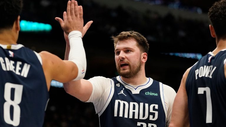 Dallas Mavericks guard Luka Doncic (77) and teammate Josh Green (8) celebrate during the second half of an NBA basketball game against the Miami Heat in Dallas, Friday, Jan. 20, 2023. (LM Otero/AP)