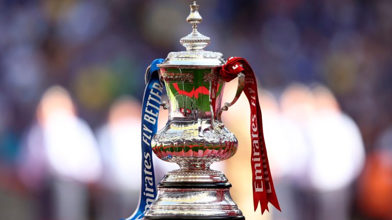 The FA Cup trophy is displayed on the pitch before the start of the English FA Cup final in London, Saturday, May 14, 2022. (Ian Walton/AP) 