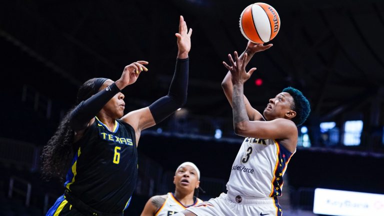 Indiana Fever guard Danielle Robinson (3) shoots over Dallas Wings forward Kayla Thornton (6) in the first half of a WNBA basketball game in Indianapolis, Sunday, July 24, 2022. (Michael Conroy/AP)
