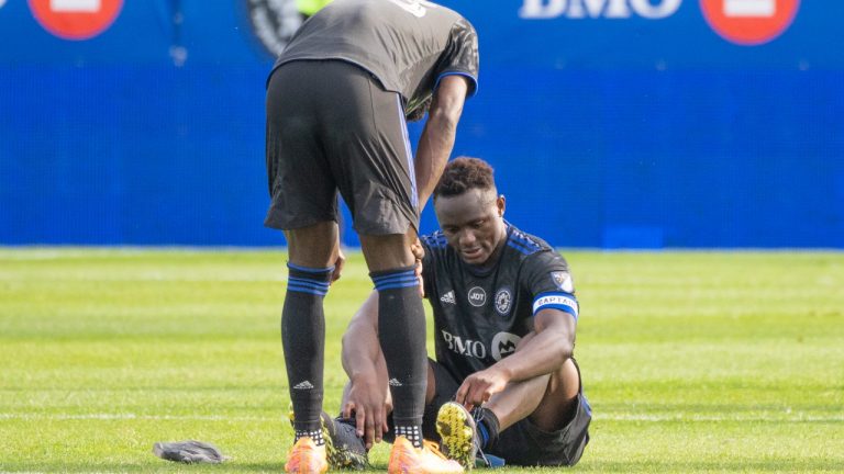 CF Montréal midfielder Victor Wanyama, right, and Kei Kamara react after losing to New York City FC in the Eastern Conference semifinals MLS action in Montreal on Sunday, October 23, 2022. (Paul Chiasson/The Canadian Press)