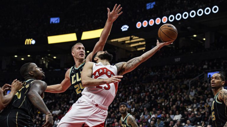 Toronto Raptors guard Fred VanVleet (23) lays up the ball past Charlotte Hornets centre Mason Plumlee (24) during first half NBA basketball action in Toronto on Tuesday, January 10, 2023. (Christopher Katsarov/CP)
