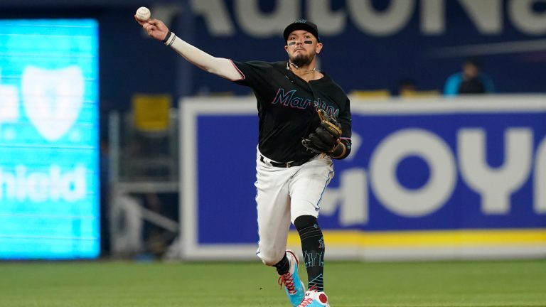 Miami Marlins shortstop Miguel Rojas (11) throws to first base on a hit by Washington Nationals' Lane Thomas during the fifth inning of a baseball game, Friday, Sept. 23, 2022, in Miami. (Marta Lavandier/AP)