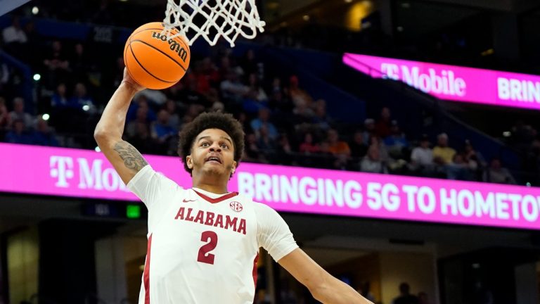 Alabama forward Darius Miles (2) goes up for a dunk over Vanderbilt guard Rodney Chatman (3) during the first half of an NCAA men's college basketball Southeastern Conference tournament game Thursday, March 10, 2022, in Tampa, Fla.