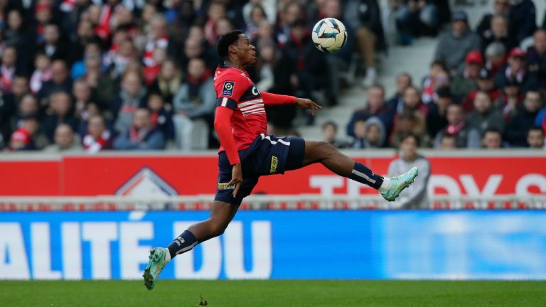 Lille's Jonathan David, of Canada, controls the ball in the air during the French League One match Lille against Angers at the Pierre Mauroy stadium Sunday, Nov. 13, 2022 in Lille, northern France. (Michel Spingler/AP)