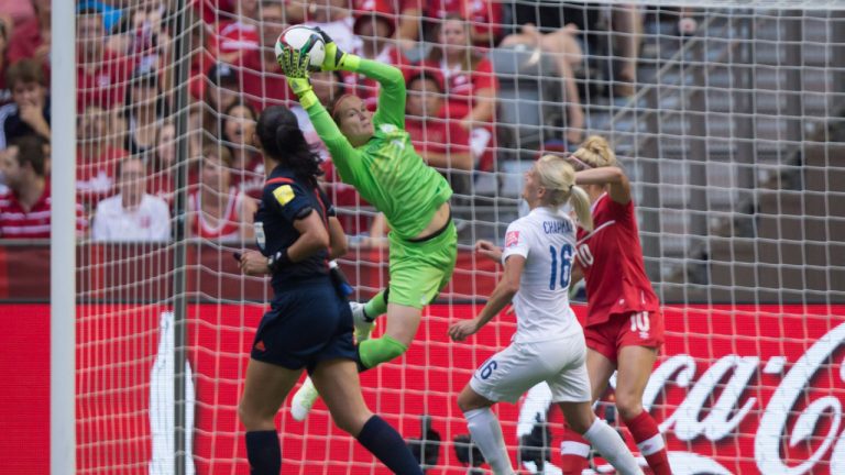Canada goalkeeper Erin McLeod makes a save in front of England's Katie Chapman (16) during second half FIFA Women's World Cup quarter-final soccer action in Vancouver, B.C., on Saturday June 27, 2015. (Darryl Dyck/CP)