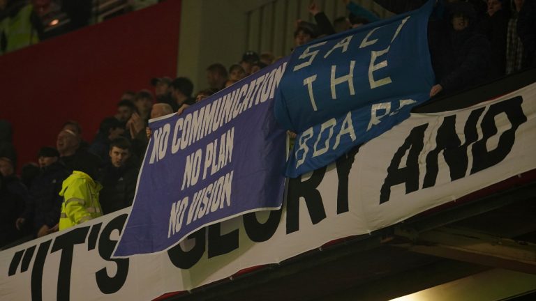 Everton fans hold banners against team's board after the English FA Cup soccer match between Manchester United and Everton at Old Trafford in Manchester, England, Friday, Jan. 6, 2023. (Dave Thompson/AP) 