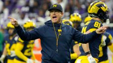 AP source: Panthers owner spoke to Jim Harbaugh about head coaching position