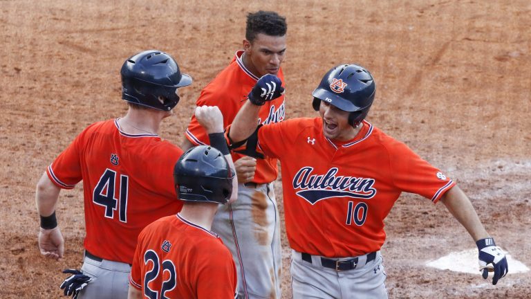 Former Auburn infielder Edouard Julien (10) celebrates during the seventh inning of a Southeastern Conference tournament NCAA college baseball game against Mississippi, Wednesday, May 23, 2018, in Hoover, Ala. (Butch Dill/AP)