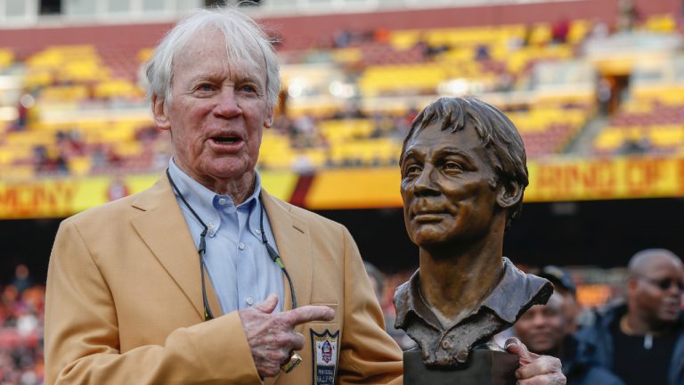 Former Washington Redskins general manager Bobby Beathard poses with his Hall of Fame trophy during halftime of an NFL football game between the Houston Texans and the Washington Redskins, Nov. 18, 2018 in Landover, Md. The four-time Super Bowl winning executive has died. He was 86. A spokesperson for the Washington Commanders said Beathard's family told the team he died earlier this week at his home in Franklin, Tennessee. (Alex Brandon/AP)