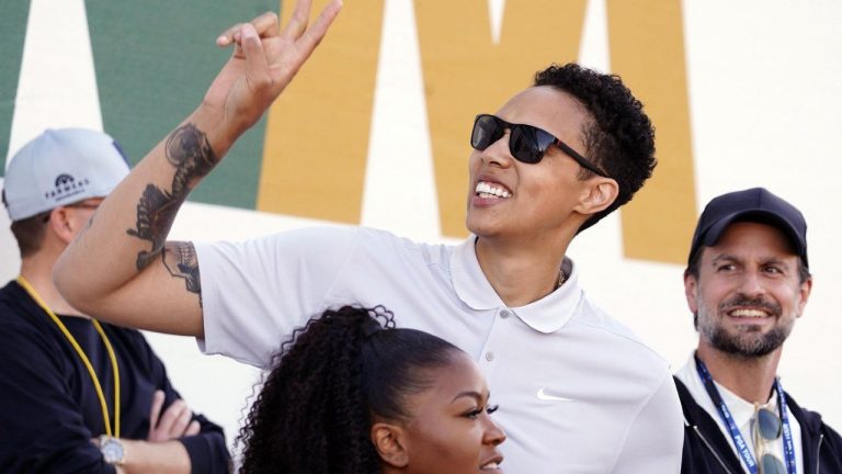American professional basketball player Brittney Griner acknowledges fans as she watches on the 16th hole during the third round of the Phoenix Open golf tournament, Saturday, Feb. 11, 2023, in Scottsdale, Ariz. (Darryl Webb/AP)