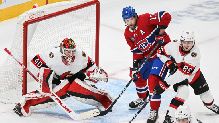 Montreal Canadiens' Josh Anderson (17) moves in on Ottawa Senators goaltender Mads Sogaard (40) as Senators' Jake Sanderson (85) defends during first period NHL hockey action in Montreal, Saturday, February 25, 2023. (CP)