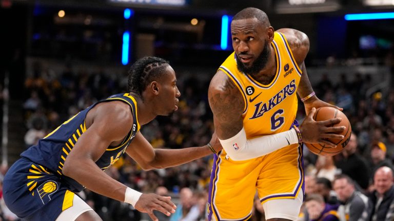 Los Angeles Lakers forward LeBron James (6) is defended by Indiana Pacers forward Aaron Nesmith (23) during the first half of an NBA basketball game. (Michael Conroy/AP)