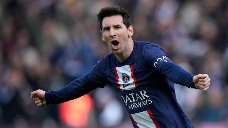 PSG's Lionel Messi celebrates after scoring his side's fourth goal during the French League One soccer match between Paris Saint-Germain and Lille. (Christophe Ena/AP)