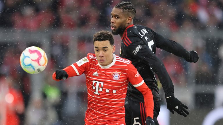 Bayern's Jamal Musiala, left, challenges for the ball with Union's Jordan Pefok during the Bundesliga soccer match between Bayern Munich and Union Berlin at the Allianz Arena in Munich, Germany, Sunday, Feb.26, 2023. (Alexandra Beier/AP ) 