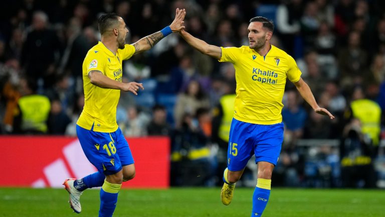 Cadiz's Lucas Perez, right, celebrates with teammate Alvaro Negredo after scoring his side's first goal during Spanish La Liga soccer match between Real Madrid and Cadiz CF at Santiago Bernabeu stadium in Madrid, Thursday, Nov. 10, 2022. (Manu Fernandez/AP)