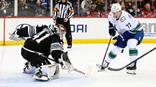 Canucks rally from three-goal deficit but fall short in overtime vs. Devils