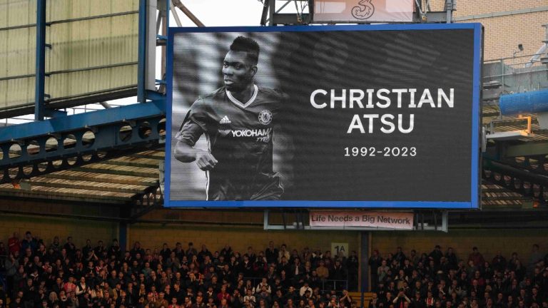 Spectators observe a moment of silence for Christian Atsu who died in Turkey earthquake before the English Premier League soccer match between Chelsea and Southampton at the Stamford Bridge stadium in London, Saturday, Feb. 18, 2023. (Kirsty Wigglesworth/AP)