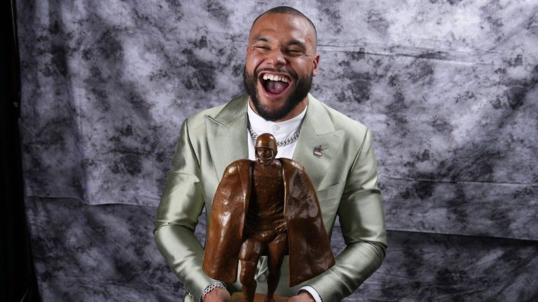 Walter Manning Player of the Year Award winner, Dallas Cowboys' Dak Prescott, poses for a photo during the NFL Honors award show ahead of the Super Bowl 57 football game, Thursday, Feb. 9, 2023, in Phoenix. (Ross D. Franklin/AP)