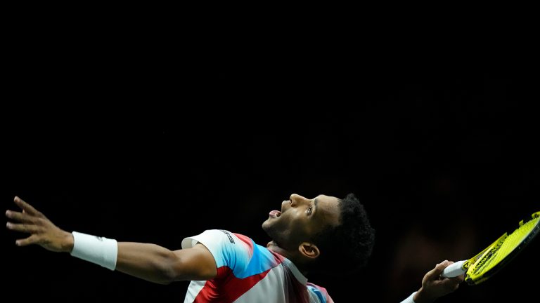 Felix Auger-Aliassime of Canada serves against Stefanos Tsitsipas of Greece in their final men's singles match of the ABN AMRO world tennis tournament at Ahoy Arena in Rotterdam, Netherlands, Sunday, Feb. 13, 2022. (Peter Dejong/AP)