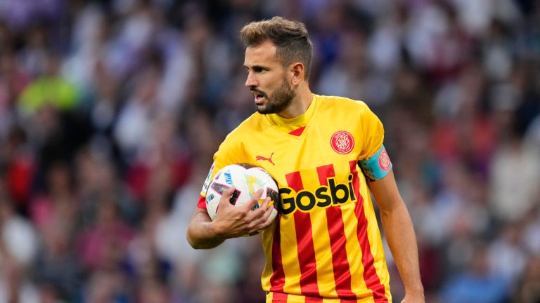 Girona's Cristhian Stuani holds the ball after scoring his side's first goal from the penalty spot during a Spanish La Liga soccer match between Real Madrid and Girona at the Santiago Bernabeu stadium in Madrid, Spain, Sunday, Oct. 30, 2022. (Jose Breton/AP)
