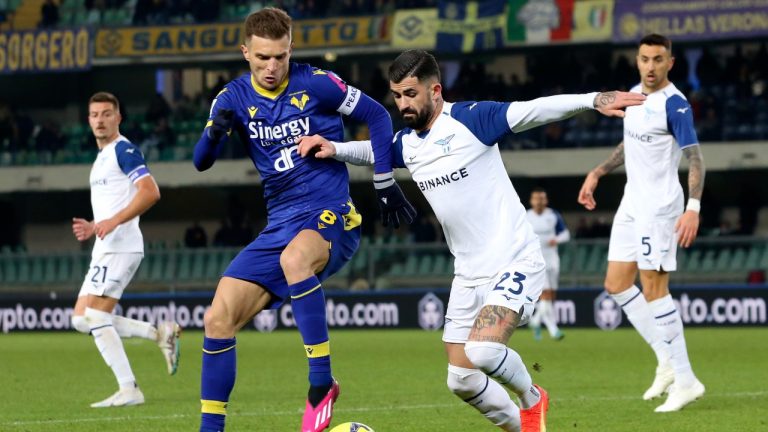 Lazio's Elseid Hysaj, right, and Verona's Darko Lazovic battle for the ball during the Serie A soccer match between Hellas Verona and Lazio at the Marcantonio Bentegodi stadium in Verona, Italy, Monday, Feb. 6, 2023. (Paola Garbuio/LaPresse via AP)
