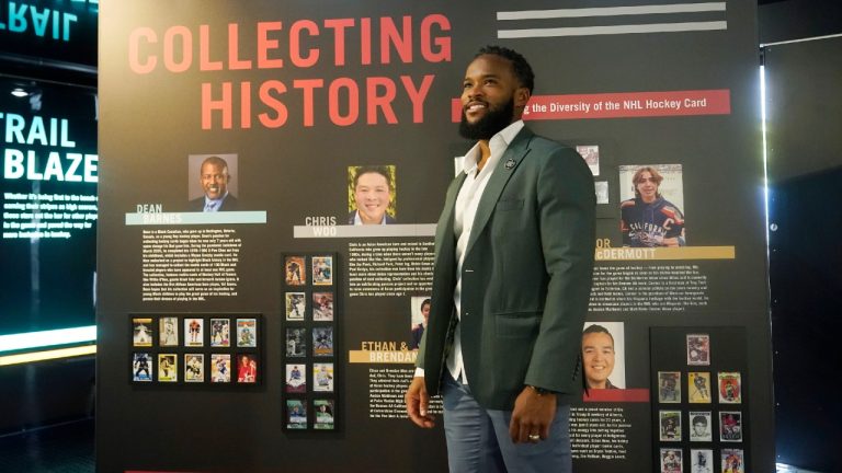 Jeff Scott, NHL vice president of Community Development and Growth, walks by one of the exhibits inside the United Hockey Mobile Museum, Thursday, Feb. 2, 2023, in Fort Lauderdale, Fla. The museum highlights the hockey careers of underrepresented communities and women. (Marta Lavandier/AP)
