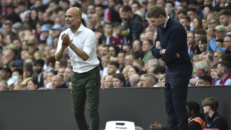 Manchester City's head coach Pep Guardiola, left, and Aston Villa's head coach Steven Gerrard during the English Premier League soccer match between Aston Villa and Manchester City at Villa Park in Birmingham, England, Saturday, Sept. 3, 2022. (Rui Vieira/AP)