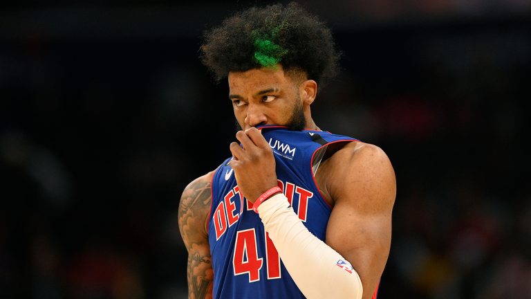 Detroit Pistons forward Saddiq Bey wipes his mouth during the second half of an NBA basketball game against the Washington Wizards, Tuesday, Oct. 25, 2022, in Washington. (Nick Wass/AP)