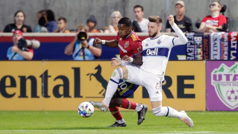 Real Salt Lakes' Sergio Cordova (10) and Vancouver Whitecaps FC's Tristian Blackmon (6) battle for the ball during an MLS soccer game, Saturday, Aug. 20, 2022 in Sandy, Utah. (Ben B. Braun/The Deseret News via AP)