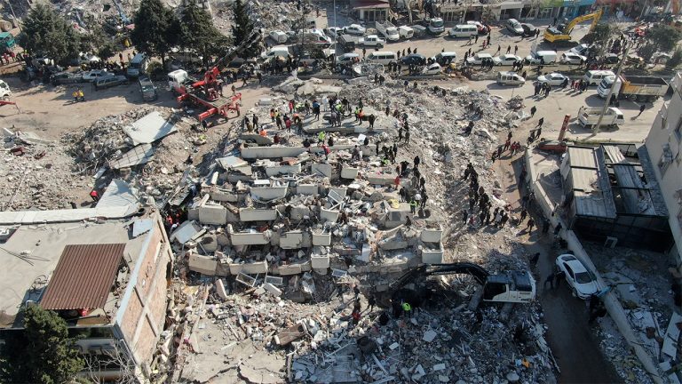 Aerial photo shows the destruction in Kahramanmaras city center, southern Turkey, Thursday, Feb. 9, 2023. Thousands who lost their homes in a catastrophic earthquake huddled around campfires and clamored for food and water in the bitter cold, three days after the temblor and series of aftershocks hit Turkey and Syria. (IHA via AP)