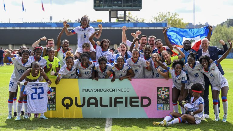 Haiti players celebrate after defeating Chile in their FIFA women's World Cup qualifier in Auckland, New Zealand, Wednesday, Feb. 22, 2023. (Andrew Cornaga/Photosport via AP)
