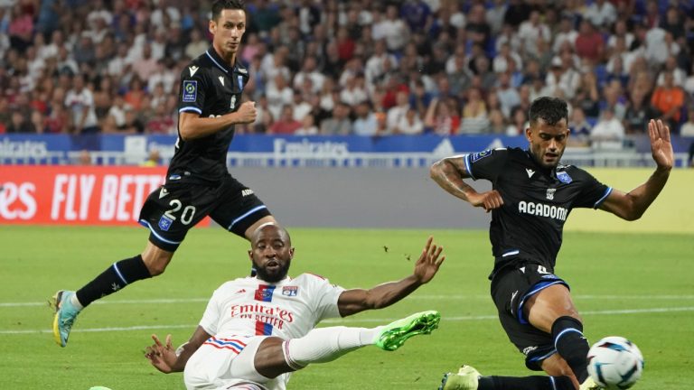 Lyon's Moussa Dembele makes an attempt to score during the French League One soccer match between Olympique Lyonnais and Auxerre at the Groupama stadium, in Lyon, France, Wednesday, Aug. 31, 2022. (Laurent Cipriani/AP)