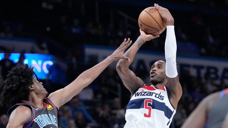Washington Wizards forward Will Barton (5) shoots over Oklahoma City Thunder forward Jalen Williams (8) in the second half of an NBA basketball game Friday, Jan. 6, 2023, in Oklahoma City. (Sue Ogrocki/AP Photo)