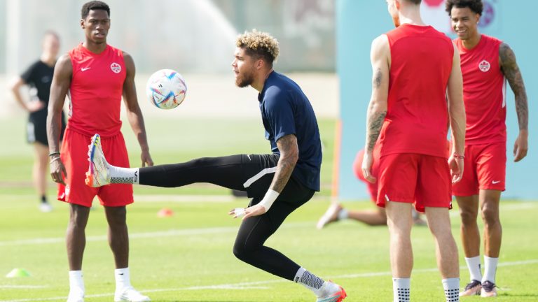Canada goalkeeper Dayne St. Clair, centre, kicks the ball with teammates during practice ahead of the World Cup in Doha, Qatar on Saturday, November 19, 2022. (Nathan Denette/CP)