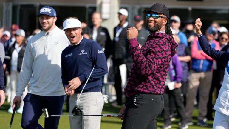 Larry Fitzgerald reacts as Josh Allen, left, looks on during the putting challenge event of the AT&T Pebble Beach Pro-Am golf tournament in Pebble Beach, Calif., Wednesday, Feb. 1, 2023. (Eric Risberg/AP)