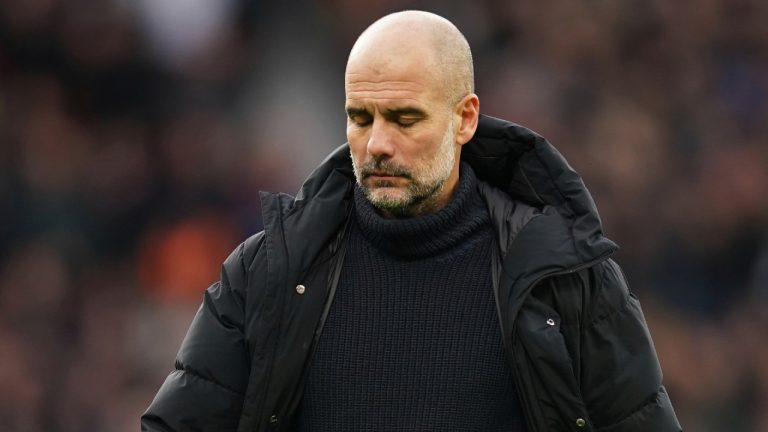 Manchester City's head coach Pep Guardiola walks on the pitch after the English Premier League soccer match between Manchester United and Manchester City at Old Trafford in Manchester, England, Saturday, Jan. 14, 2023. (Dave Thompson/AP)