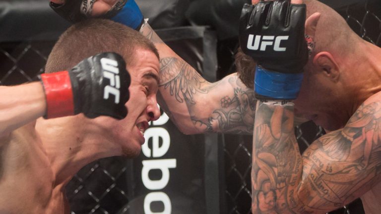 Jeremy Kennedy, left, of Surrey, B.C., and Alessandro Ricci, of Woodbridge, Ont., fight during a lightweight bout during a UFC Fight Night event in Vancouver, B.C., on Saturday August 27, 2016. (Darryl Dyck/CP)