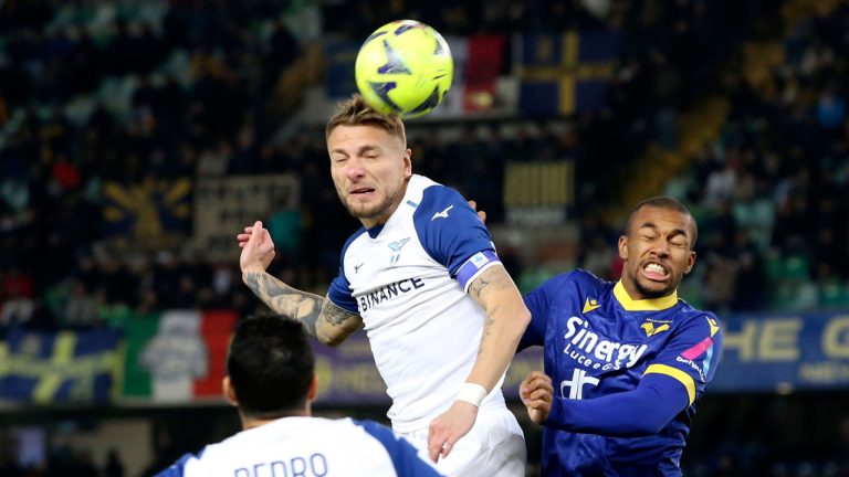 Lazio's Ciro Immobile heads the ball past Verona's Isak Hien, right, during the Serie A soccer match between Hellas Verona and Lazio at the Marcantonio Bentegodi stadium in Verona, Italy. (Paola Garbuio/AP)