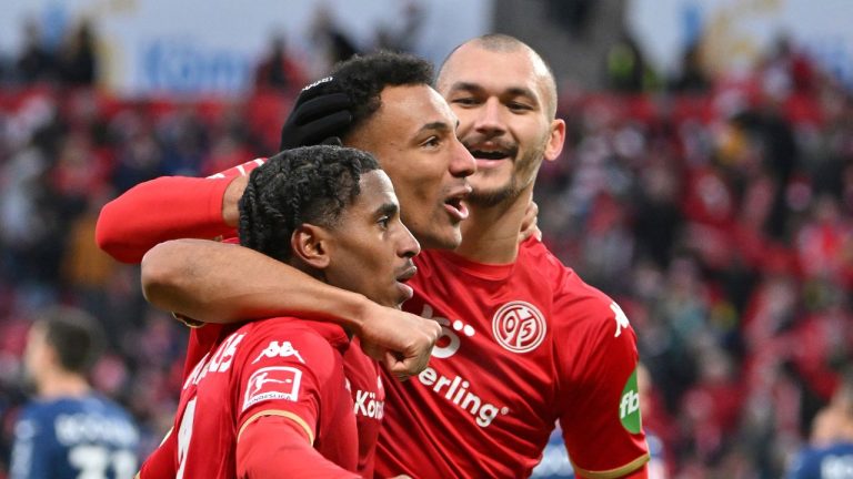 Karim Onisiwo from Mainz celebrates with his teammates after scoring during the German Bundesliga soccer match between FSV Mainz and VfL Bochum in Mainz, Germany, Saturday, Jan. 28, 2023 (Torsten Silz/dpa via AP)