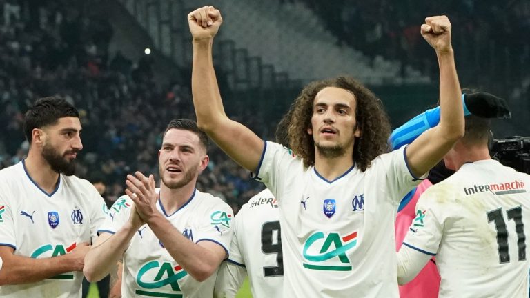 Marseille's players celebrate after winning the French Cup soccer match between Olympique de Marseille and Paris Saint Germain at the Velodrome stadium in Marseille, southern France, Wednesday, Feb. 8, 2023. Olympique de Marseille won 2-1.