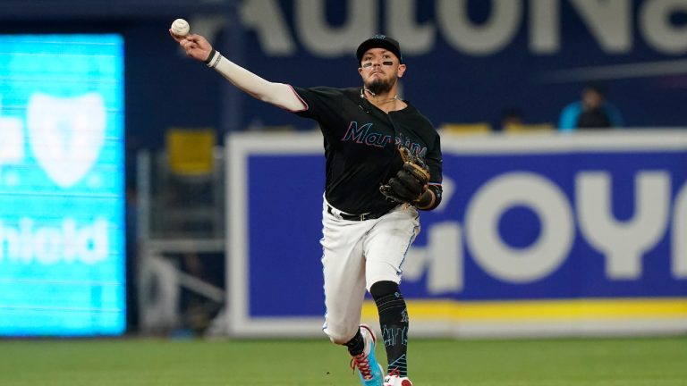 Miami Marlins shortstop Miguel Rojas (11) throws to first base on a hit by Washington Nationals' Lane Thomas during the fifth inning of a baseball game, Friday, Sept. 23, 2022, in Miami. (Marta Lavandier/AP)
