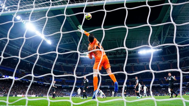 Elche's goalkeeper Edgar Badia makes a save during Spanish La Liga soccer match between Real Madrid and Elche CF at the Santiago Bernabeu stadium in Madrid, Spain, Wednesday, Feb. 15, 2023. (Manu Fernandez/AP Photo)
