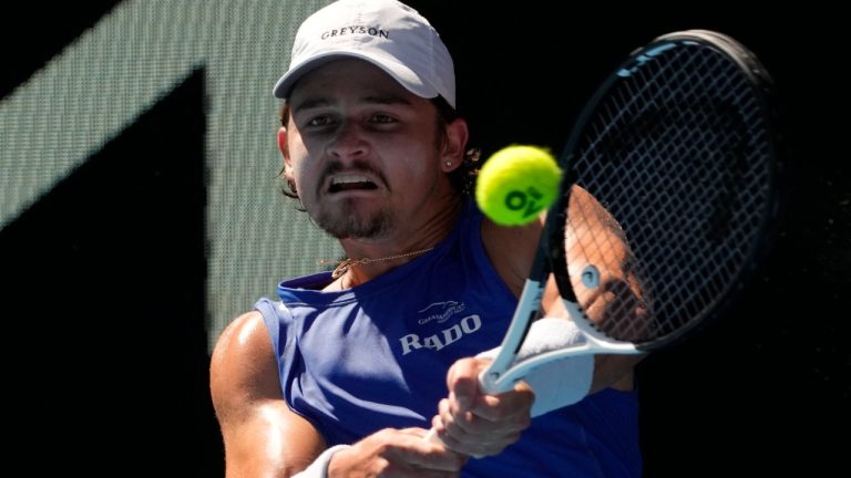 J.J. Wolf of the U.S. plays a backhand return to compatriot Ben Shelton during their fourth round match at the Australian Open tennis championship in Melbourne, Australia, Monday, Jan. 23, 2023. (Ng Han Guan/AP)