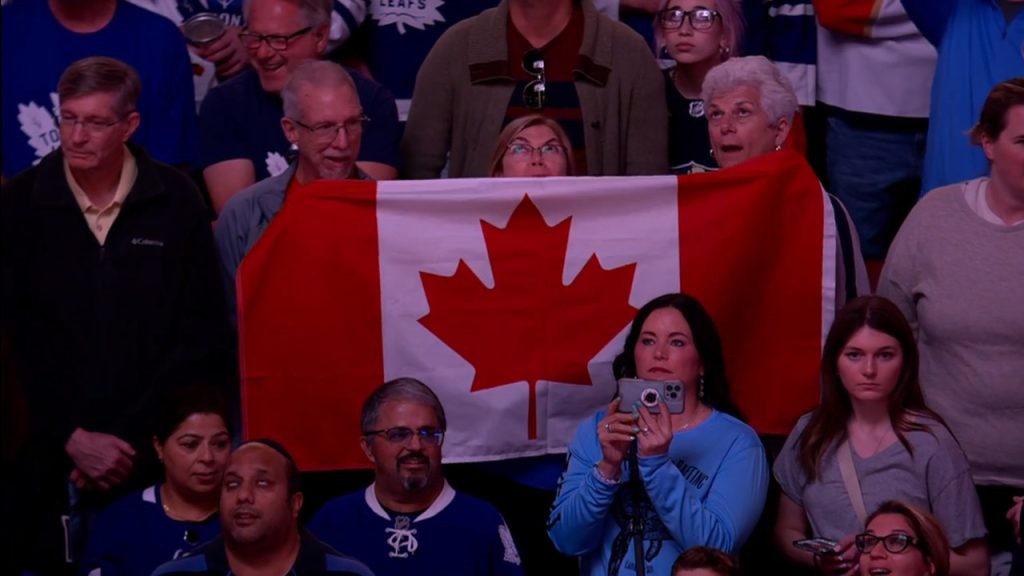 The Barenaked Ladies don Toronto Maple Leaf jerseys and sing the national  anthem on center ice before the game as the Leafs host the Ottawa Senators  on opening night of the new