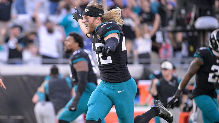 Jacksonville Jaguars safety Andrew Wingard (42) celebrates the win against the Baltimore Ravens after an NFL football game, Sunday, Nov. 27, 2022, in Jacksonville, Fla.(Phelan M. Ebenhack/AP)