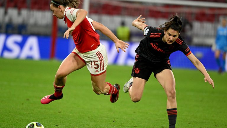 Bayern's Jovana Damnjanovic, right, and Arsenal's Katie McCabe battle for the ball during the women's Champions League first leg quarterfinal soccer match between Bayern Munich and Arsenal at Allianz Arena, Munich, Germany, Tuesday March 21, 2023. (Peter Kneffel/AP)