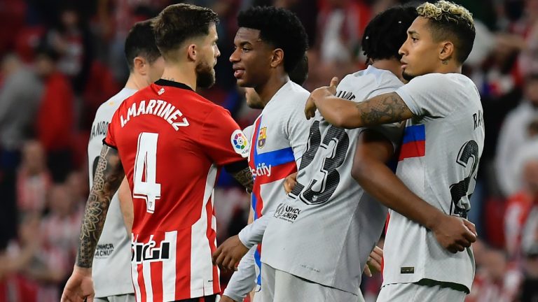 Barcelona's Raphinha, right, celebrates with Barcelona's Jules Kounde after the Spanish La Liga soccer match between Athletic Club and Barcelona at the San Mames stadium in Bilbao, Spain, Sunday, March 12, 2023. (Alvaro Barrientos/AP)