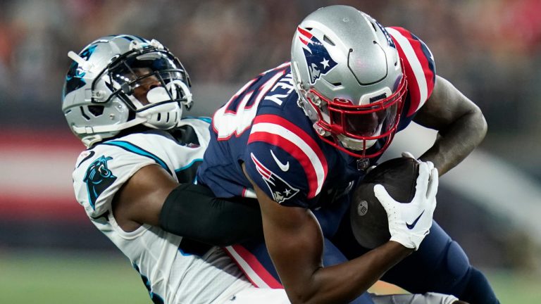 Carolina Panthers safety Sean Chandler, left, tackles New England Patriots wide receiver Lil'Jordan Humphrey during the first half of a preseason NFL football game Friday, Aug. 19, 2022, in Foxborough, Mass. (Charles Krupa/AP) 